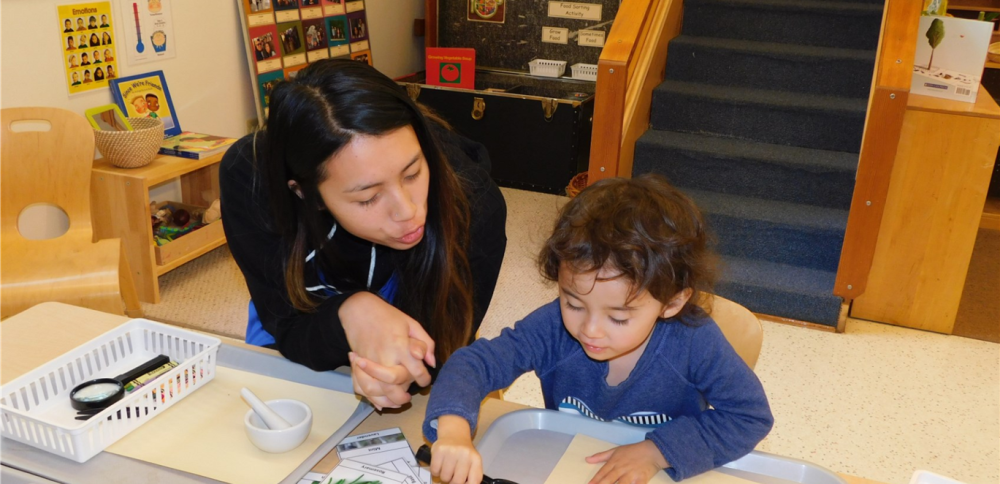 Teacher and child doing science